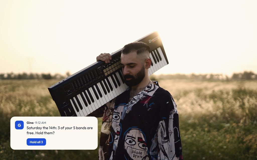 Musician carrying a keyboard on one shoulder across a field at golden hour, with a Gina message showing three of five bands free on Saturday.